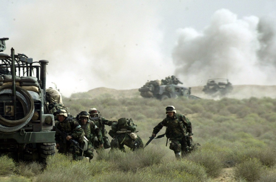 MARINES OF FOX COMPANY "RAIDERS" TAKE COVER IN SOUTHERN IRAQ